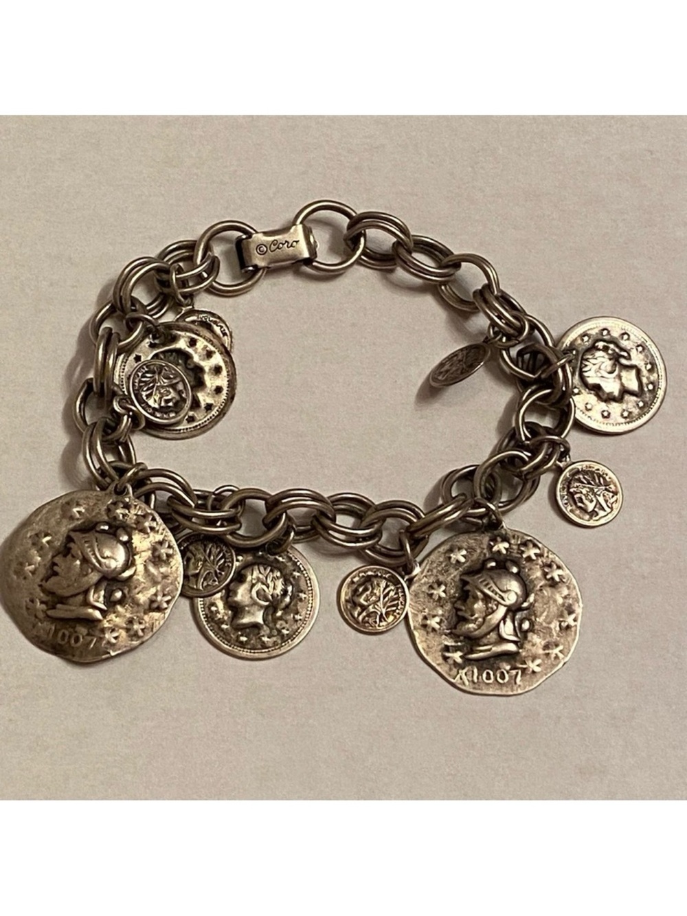 CORO SIGNED BRACELET LINKS 11 CHARMS FAUX COINS HERALDIC ANTIQUED SILVER TONE 7”